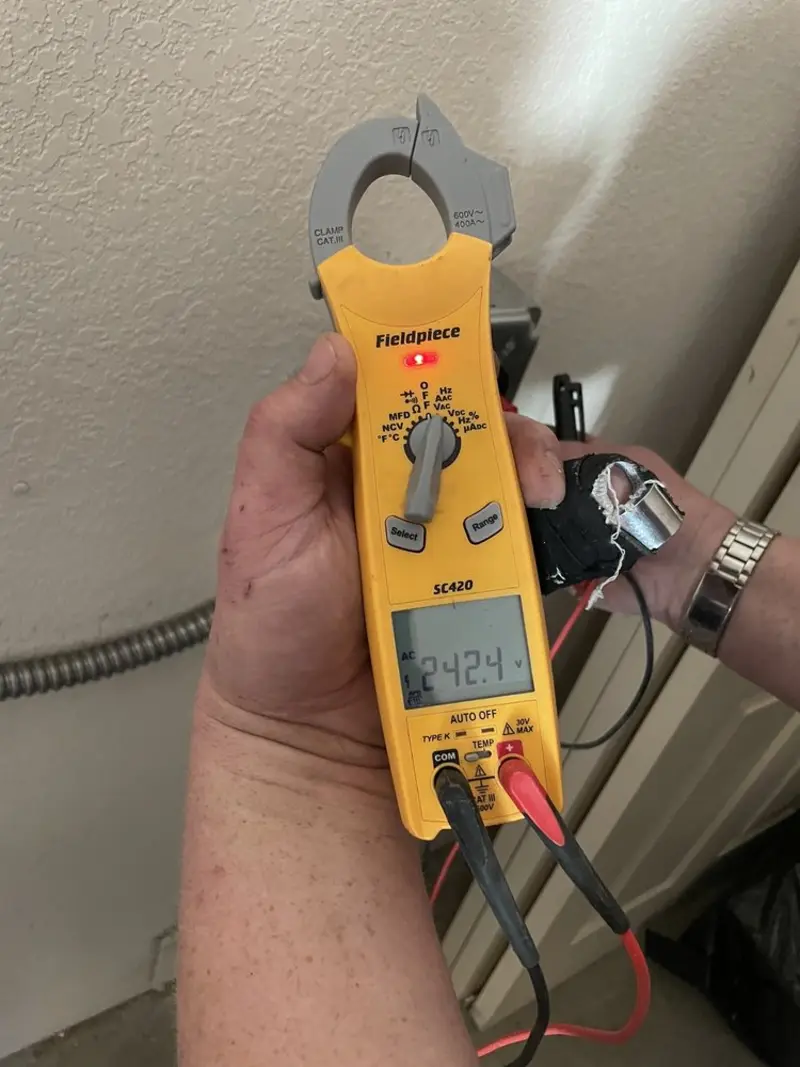 Voltage testing with clamp meter during Electrical Installation Services in Lexington Park